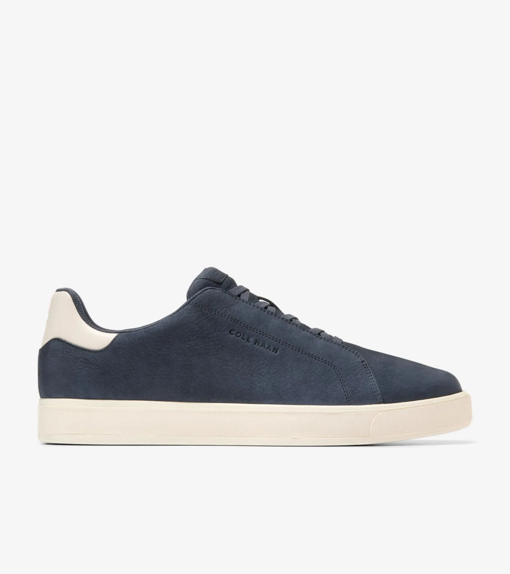 Vista lateral de las zapatillas Cole Haan GrandPrø Luxe Slip-On C40668 en azul marino