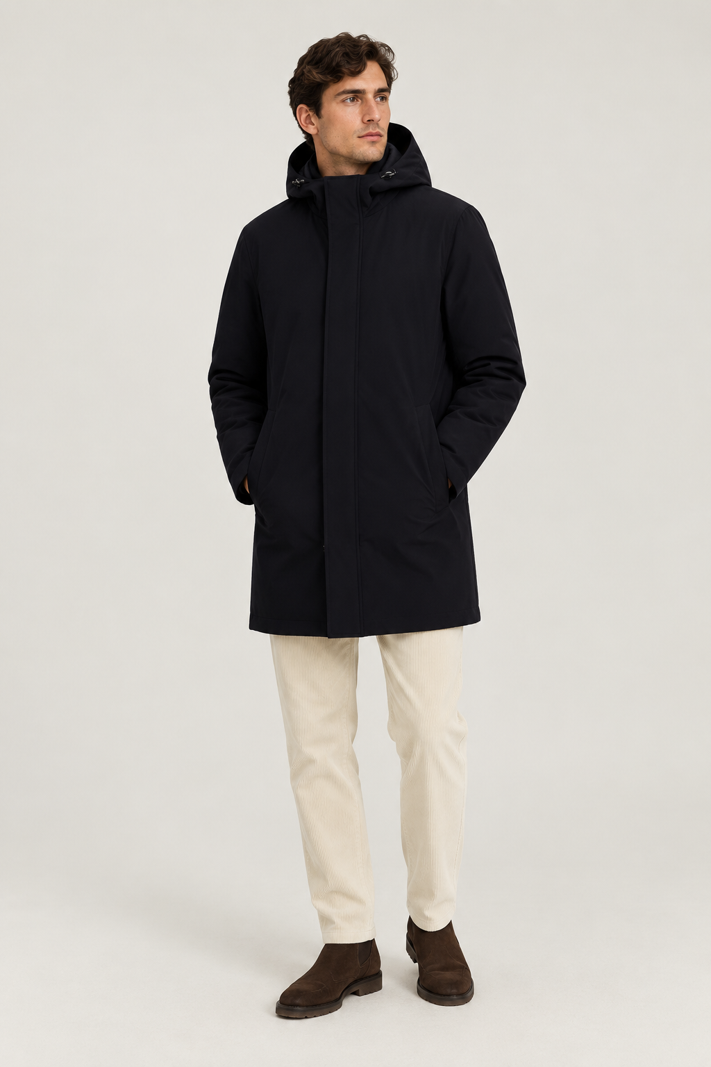 Chaquetón Herno azul con pantalón de pana crema y botas